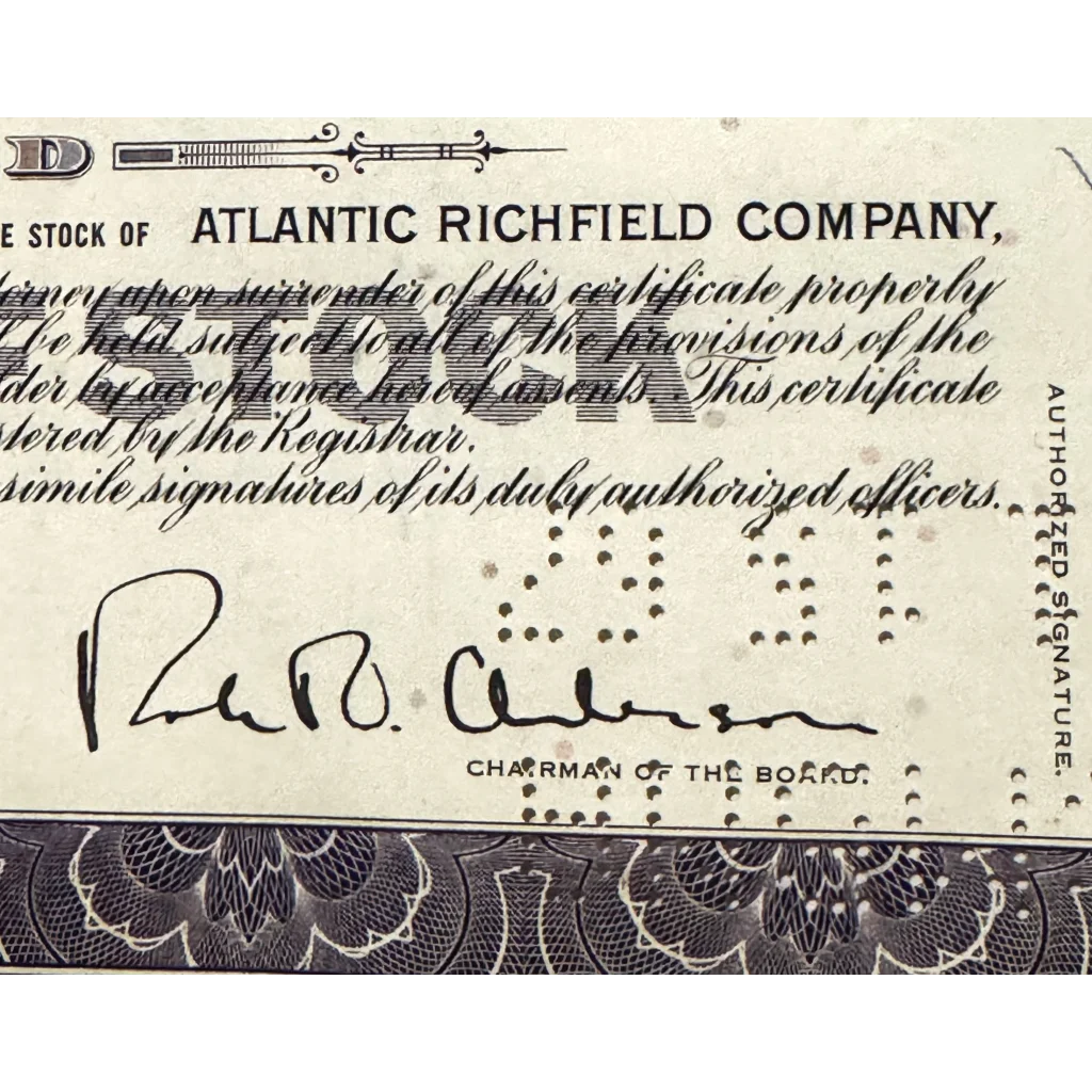 Portion of a rare Atlantic Richfield stock certificate showcasing signature and ornate design