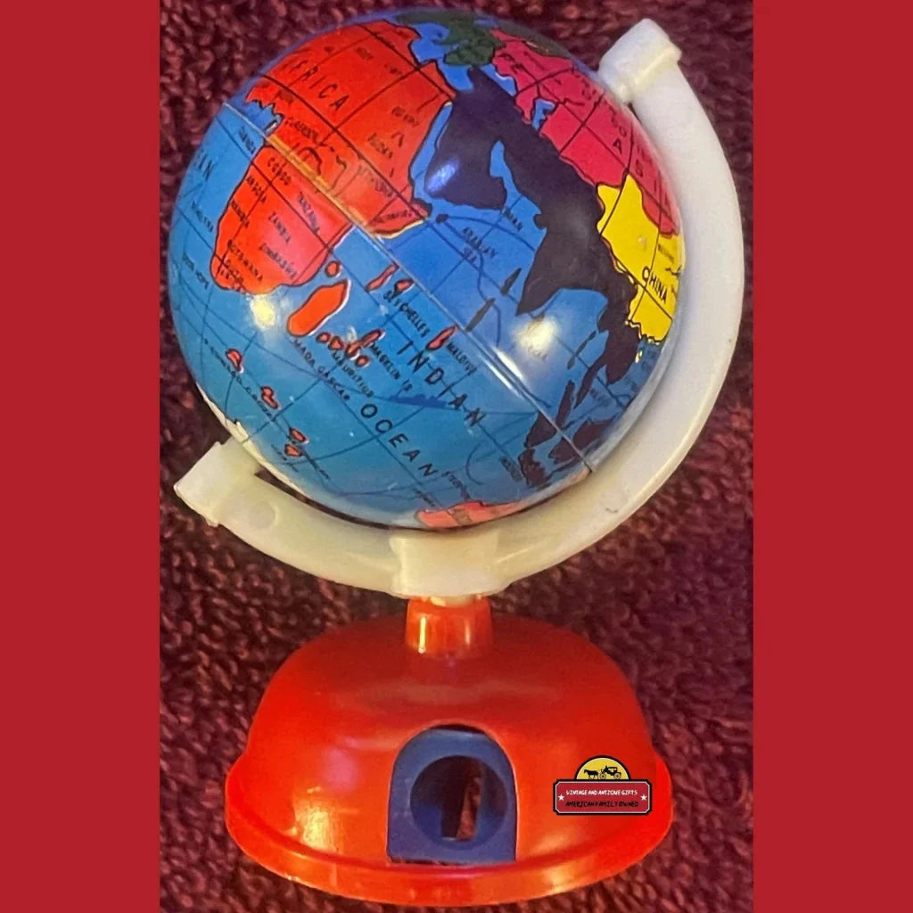 Colorful globe pencil sharpener on a red base, perfect for retro vibes and nostalgia