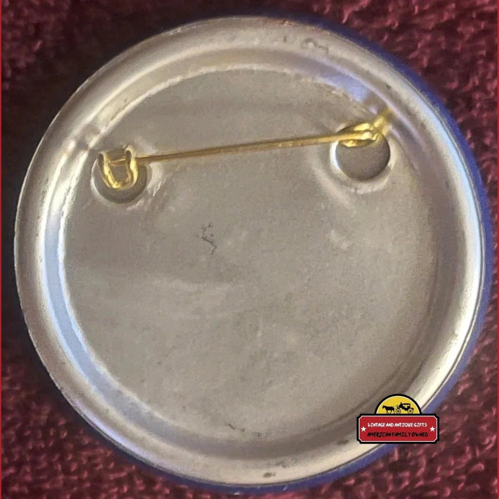 Circular metal pin with fastening, showcasing the 1960s Vietnam War Peace Dove design