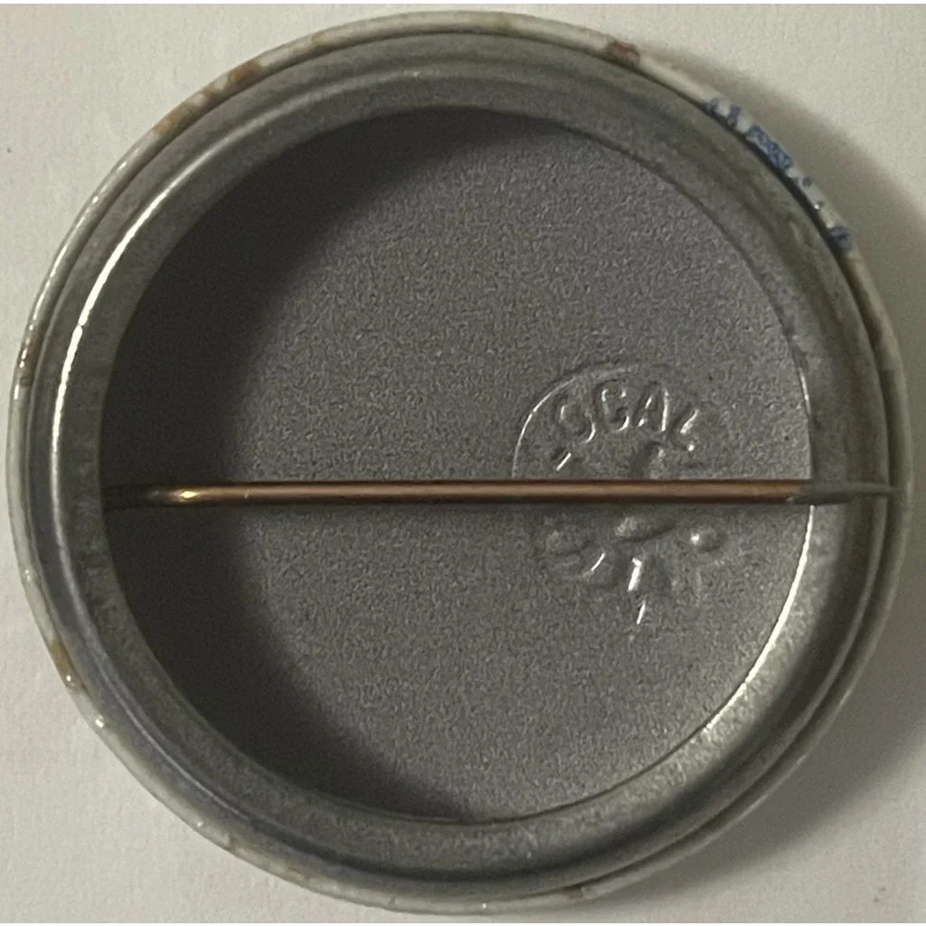 Circular metal lid with split design and embossing from the 1960s Vietnam War era