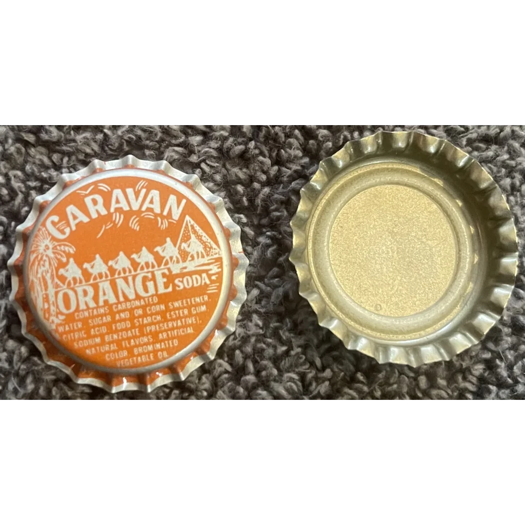 Two distinctive bottle caps, one Caravan Orange and a plain gold, showcasing retro vibes