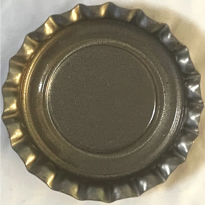 Metallic bottle cap with a ridged edge from Rare 1970s Sun-Rise Grape Soda