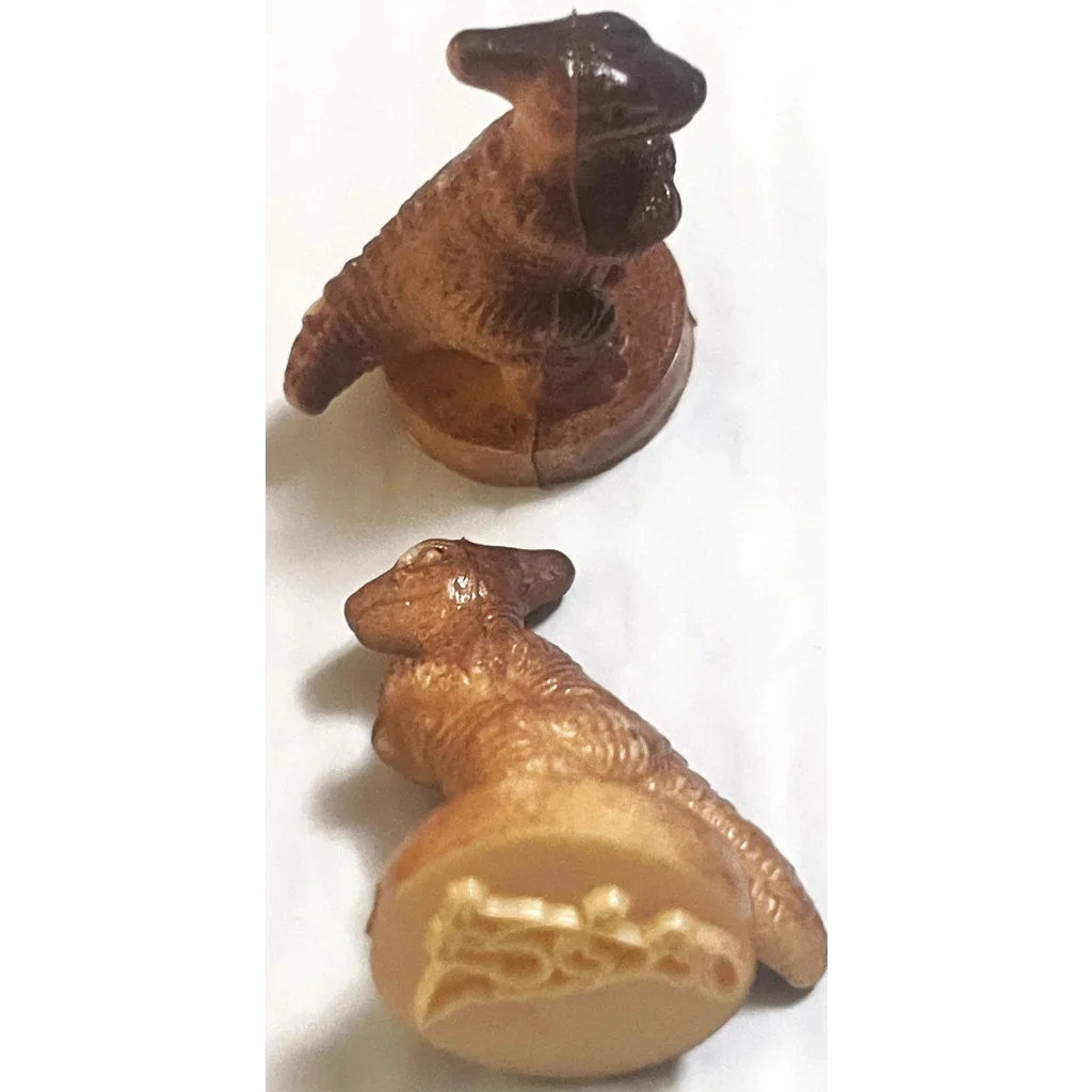 Ceramic bird-like creature figurine next to Rare Vintage 1970s Dinosaur Rubber Stamps