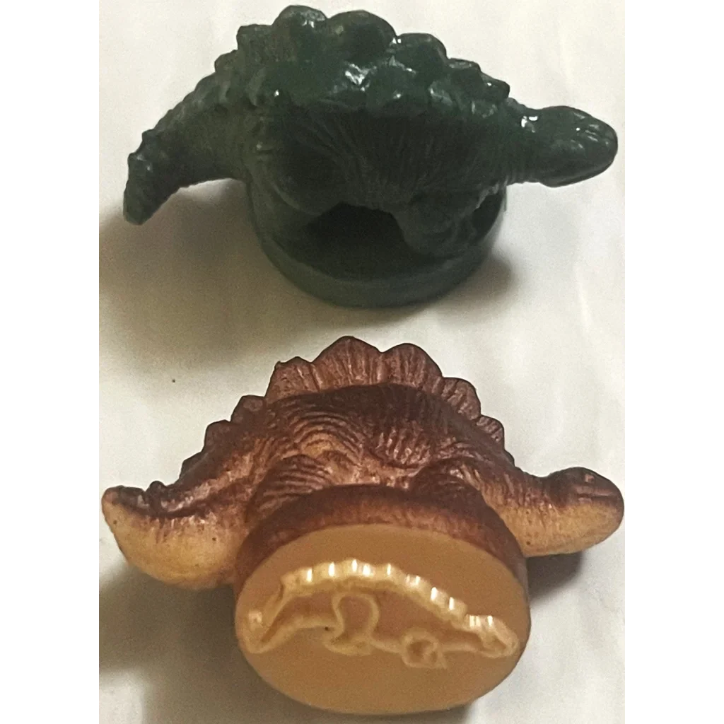 Two plastic toy dinosaur figurines in green and brown for Rare Vintage 1970s Dinosaur Rubber Stamps