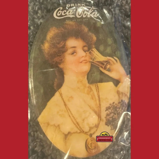 Vintage Coca-Cola advertising tray featuring a woman enjoying cola, perfect antique gift