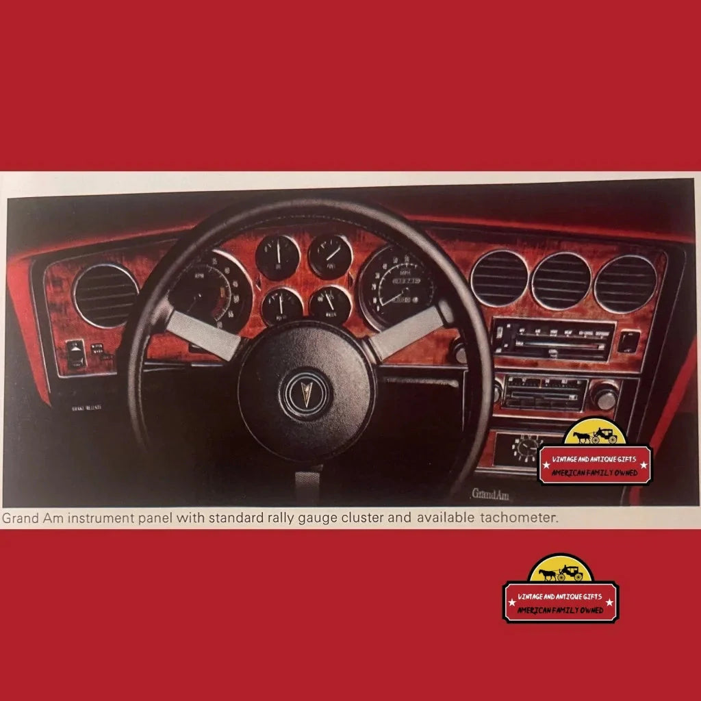 Dashboard and steering wheel of a classic Pontiac Firebird in a rare vintage dealer brochure