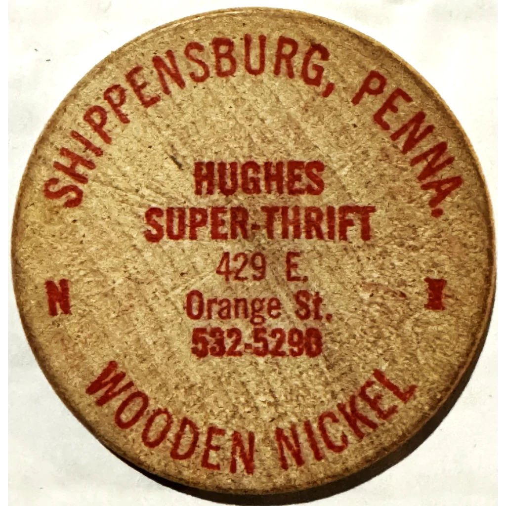 Circular wooden token promoting Hughes Super-Thrift in Shippensburg, Pennsylvania, Revolution Wooden Nickel