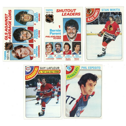 Vintage 1978 Topps hockey cards featuring Mike Bossy, Guy Lafleur, and Ken Dryden