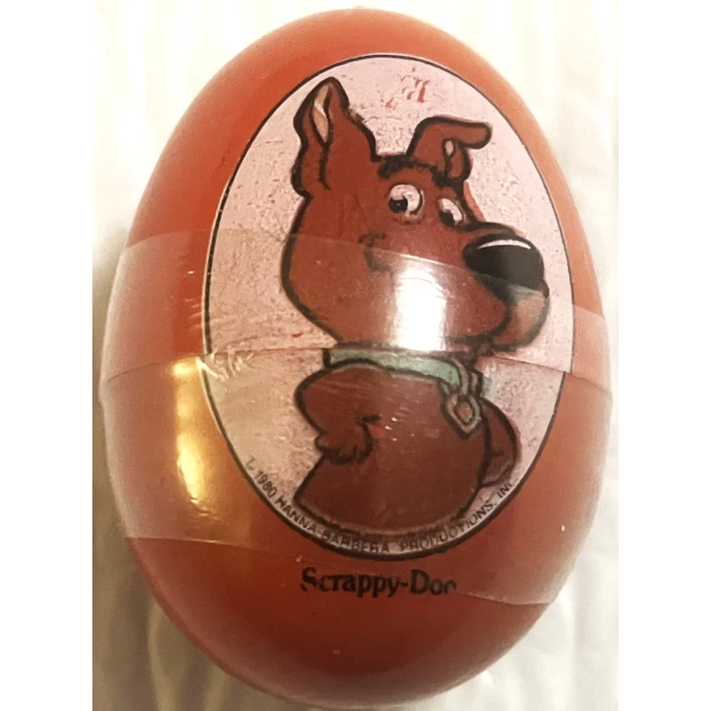 Red Hanna Barbera plastic egg container with Scrappy-Doo cartoon design, 80s collectible