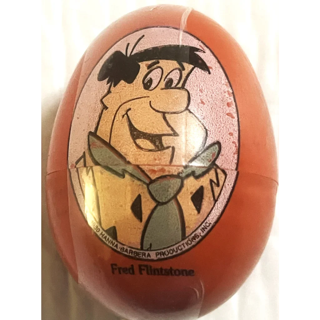 Rare Hanna Barbera Plastic egg-shaped toy of a Flintstones character, sealed collectible