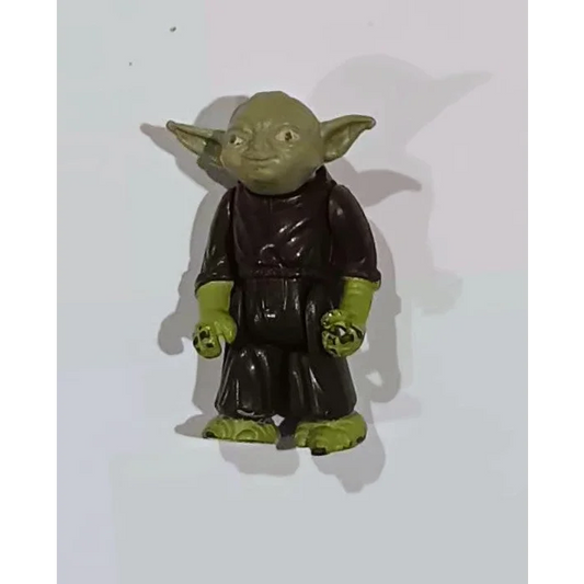 Vintage Star Wars Yoda action figure in green with black robe