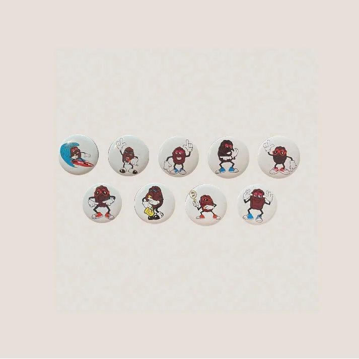 Vintage 1980s complete California Raisins tin pins featuring character buttons for collectors