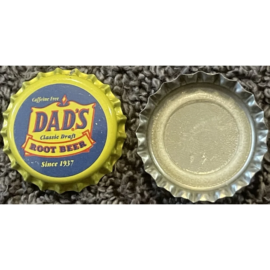 Rare 1980s Dad’s Root Beer bottle cap with yellow rim and blue center from Chicago