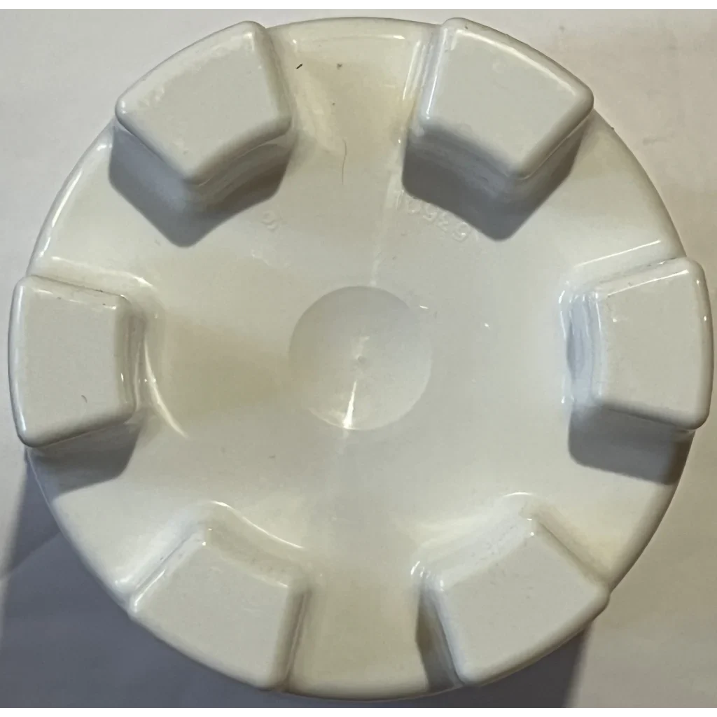 White circular plastic object with tabs from Retro McDonald’s Super Summer Sandcastle Bucket