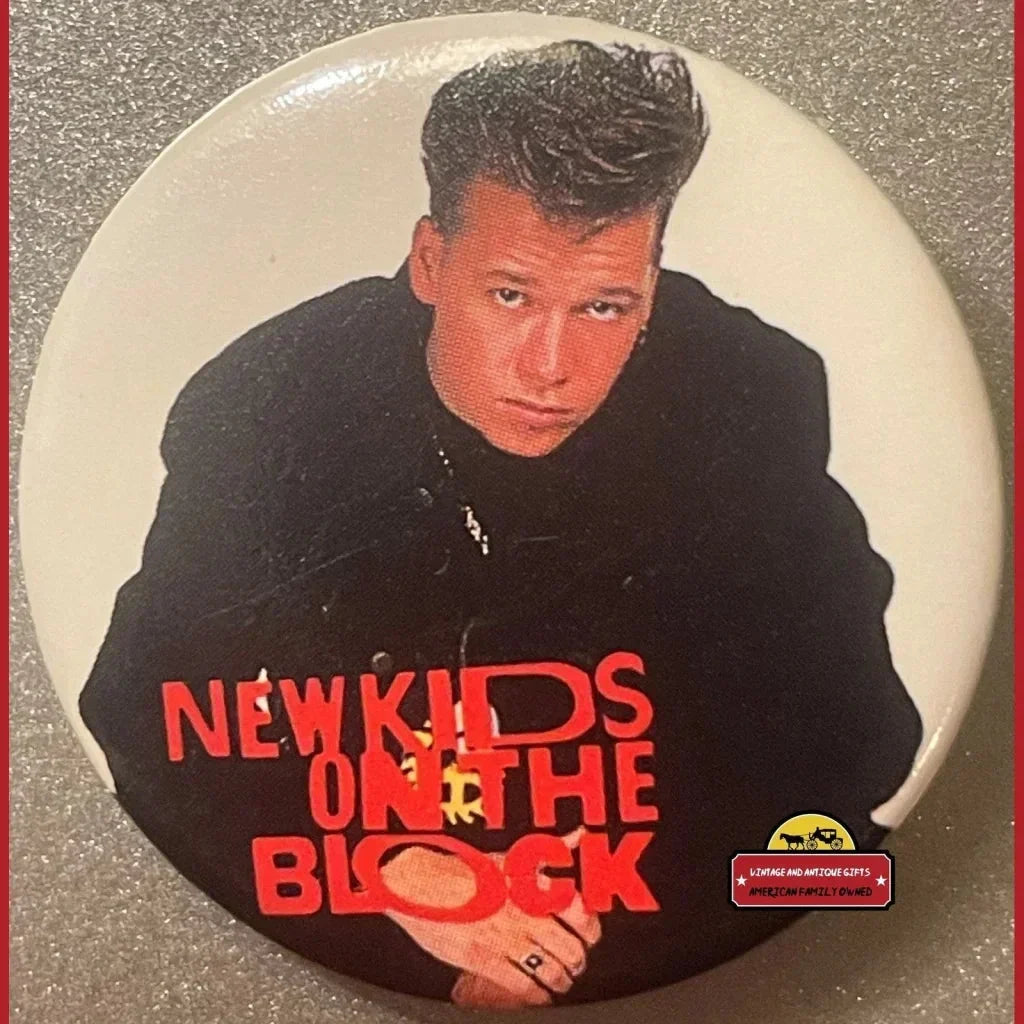 Circular pin featuring Donnie Wahlberg in black with New Kids on the Block text, vintage collectible