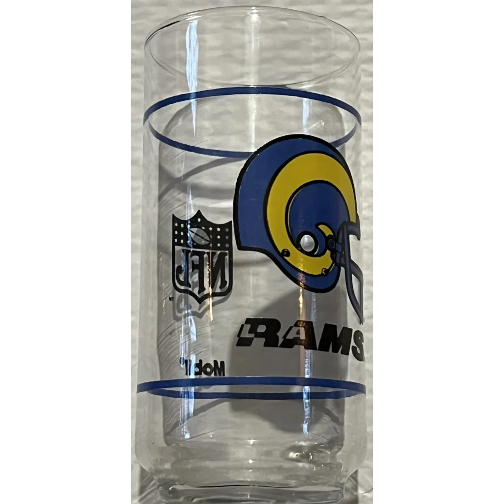 Clear drinking glass featuring Los Angeles Rams logo from vintage 1980s NFL Mobil Set