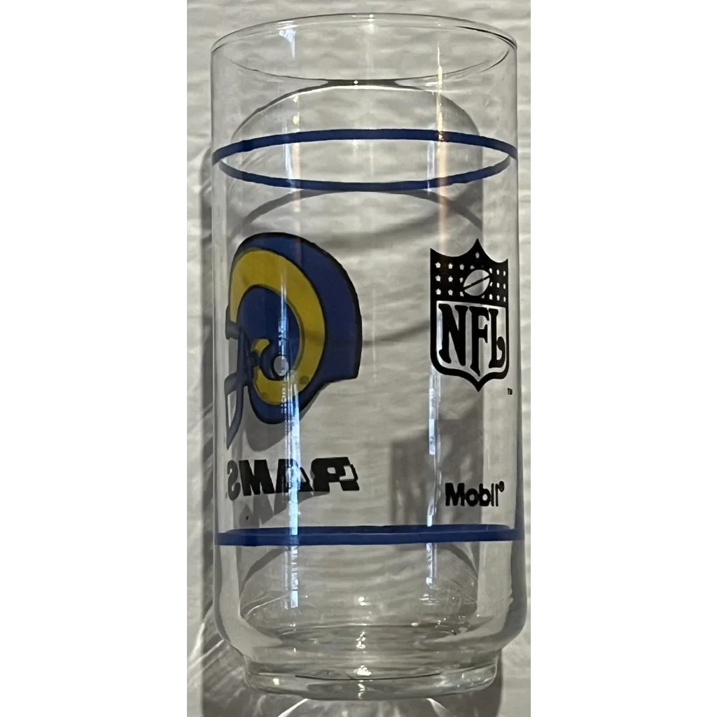 Clear glass tumbler with NFL and Los Angeles Rams logos from vintage 1980s NFL set