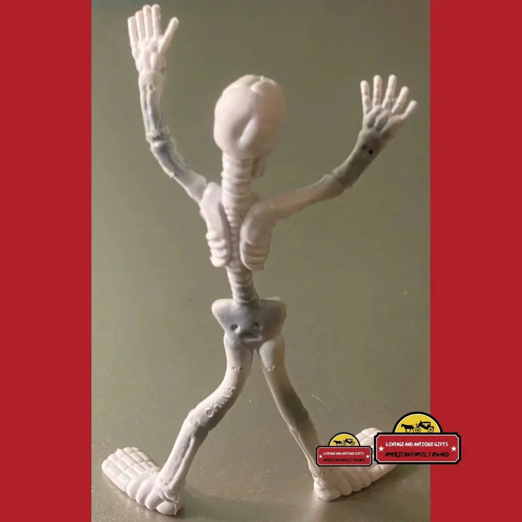 Humanoid poseable skeleton toy made of white bandages striking a fun I Spy pose