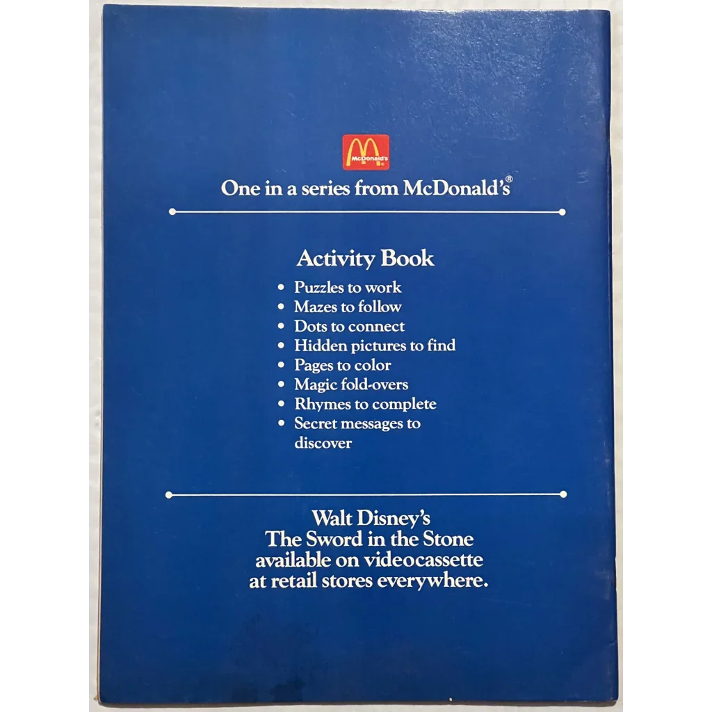 Blue activity book from McDonald’s featuring puzzles from The Sword in the Stone