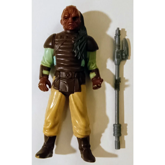 Vintage 1983 Kenner Star Wars action figure Weequay in brown and yellow with green shirt, black boots, and weapon