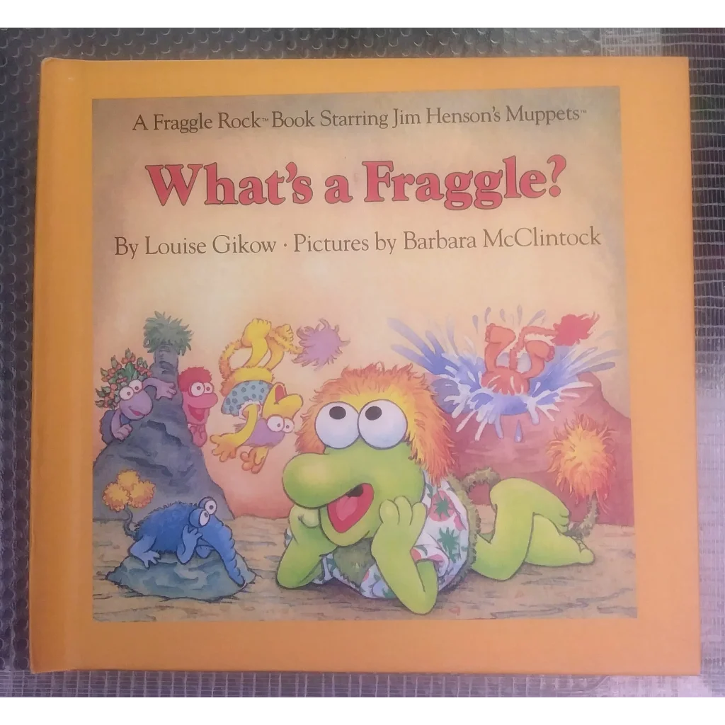 Vintage Fraggle Rock plush toy in yellow-green with red hair and floral shorts