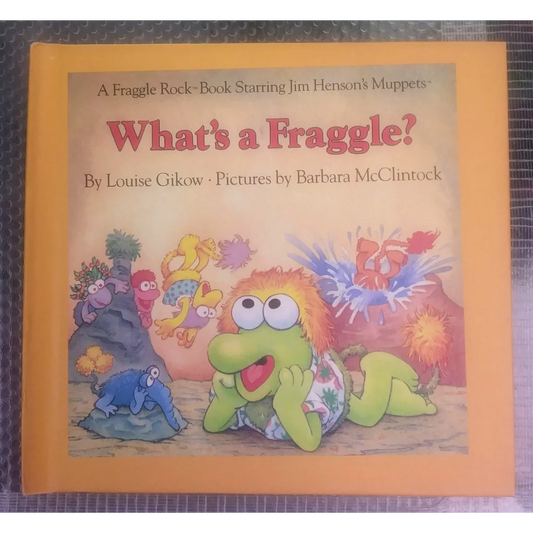 Vintage Fraggle Rock plush toy in yellow-green with red hair and floral shorts