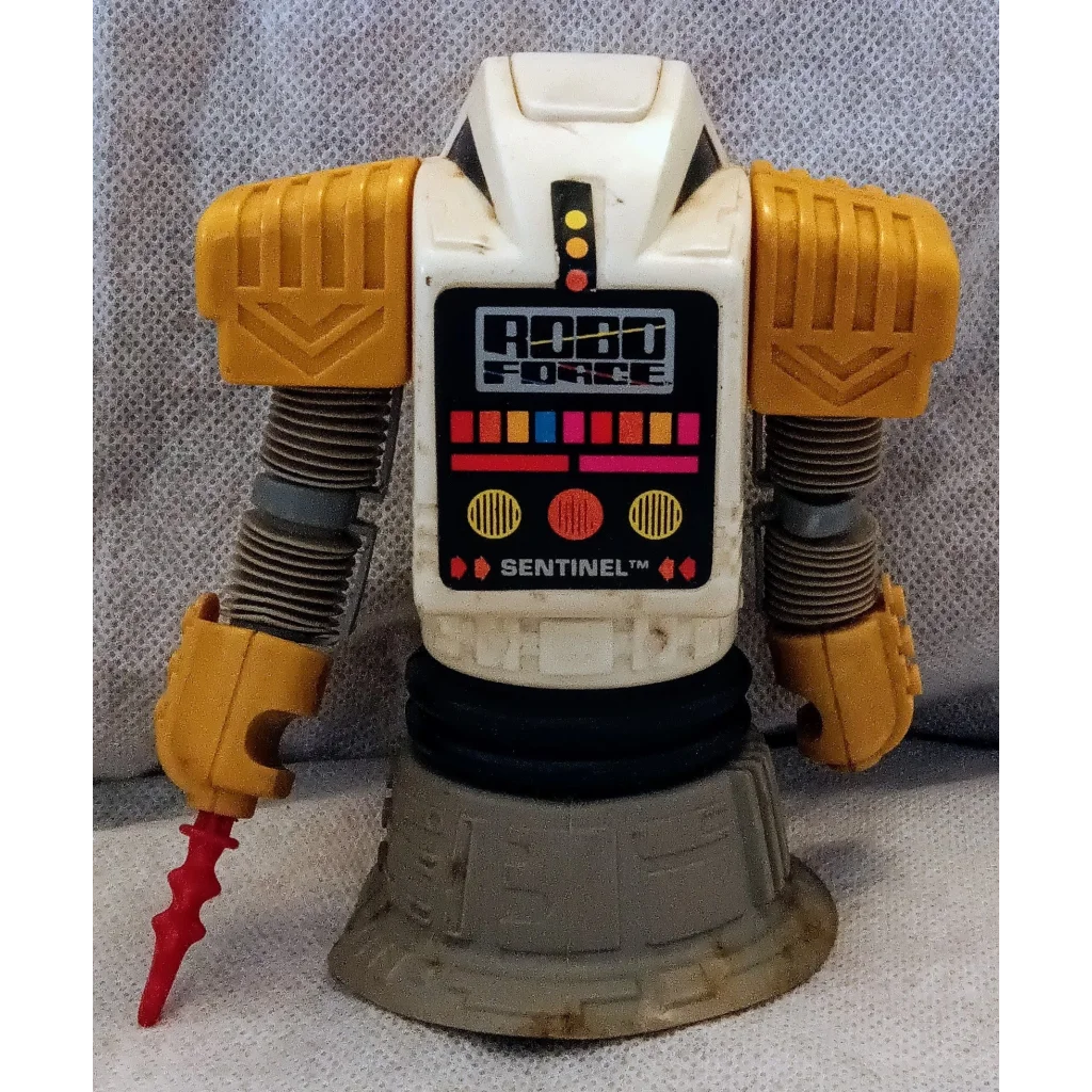 Vintage 1984 Robo Force Robot Sentinel toy with yellow body and red claw