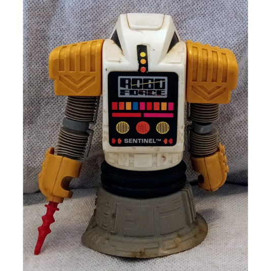 Vintage 1984 Robo Force Robot Sentinel toy with yellow body and red claw