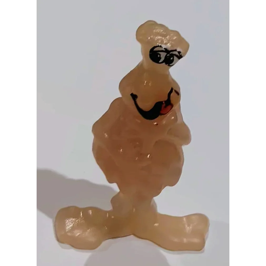 Vintage 1986 Soggy Kangaroo tan PVC figure with smiling face and glow-in-the-dark