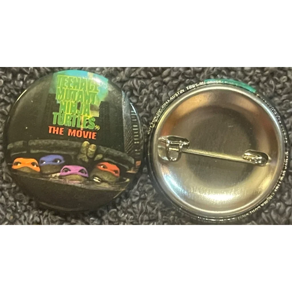 Promotional button for Teenage Mutant Ninja Turtles: The Movie with turtle eyes peeking out