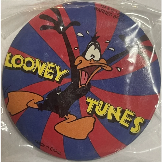 Vintage Looney Tunes Pin with Daffy Duck on a cool red and blue striped background