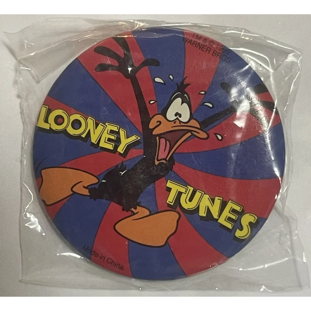 Vintage Looney Tunes Pin with Daffy Duck on a fun red and blue starburst background