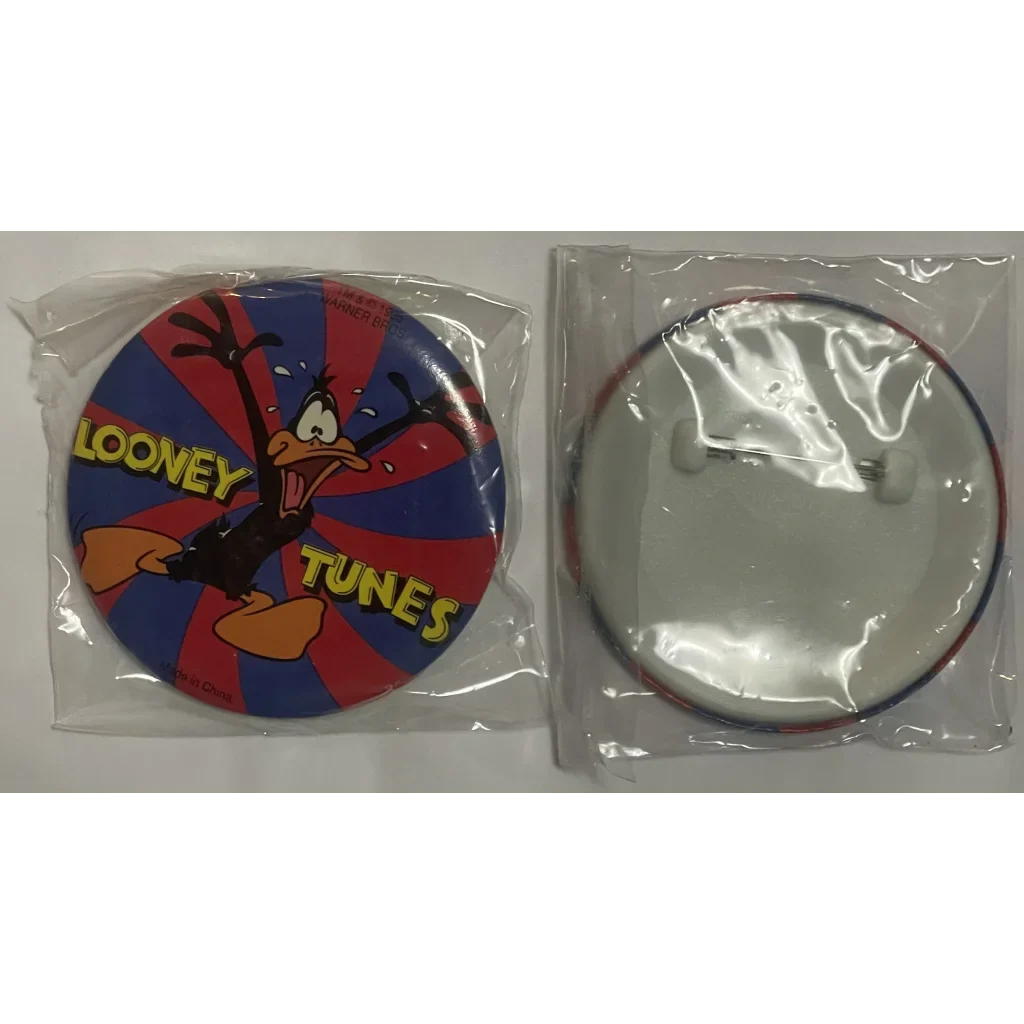 Vintage Looney Tunes pin with Daffy Duck on a fun, colorful background