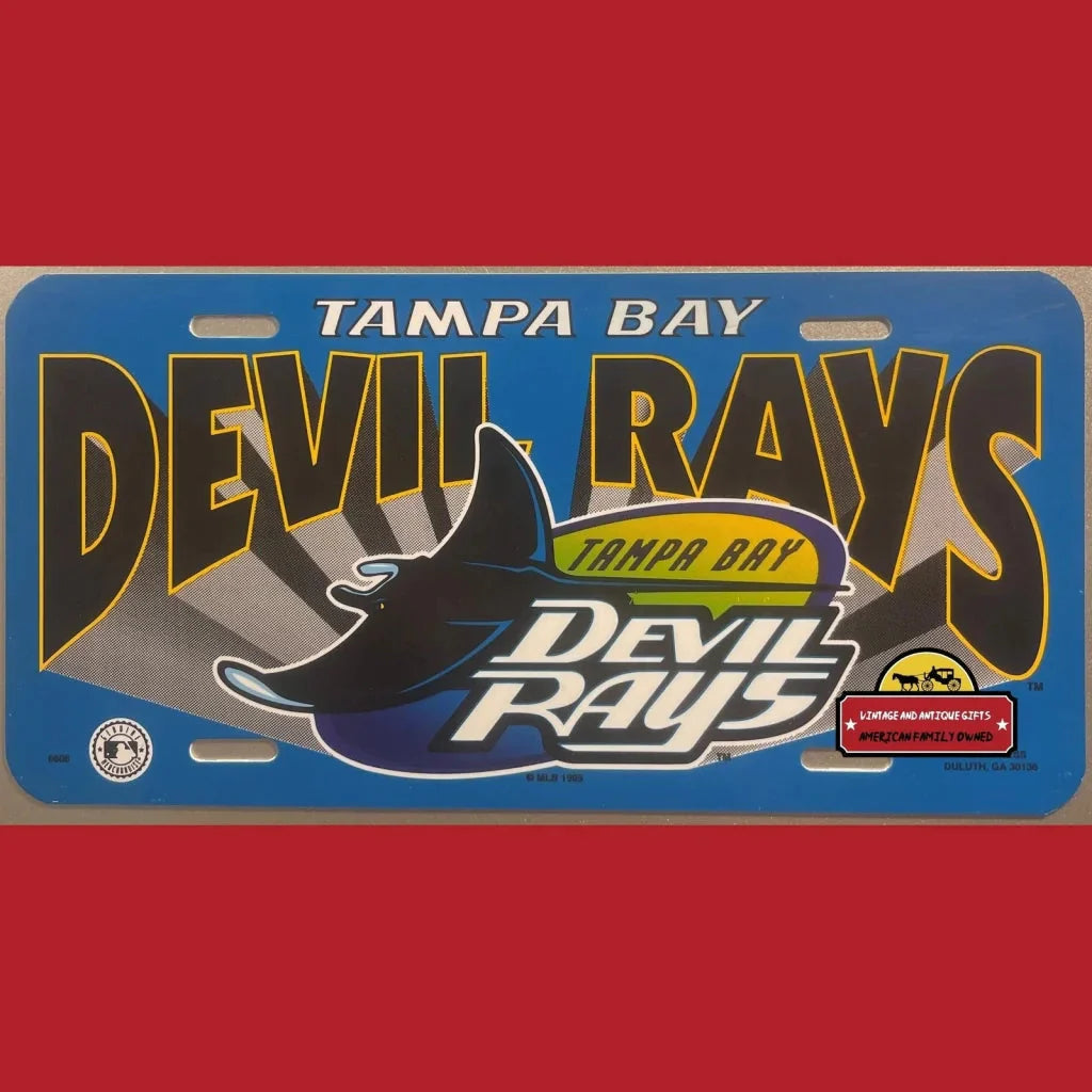 Vintage 1990s Tampa Bay Devil Rays MLB license plate with team logos and text