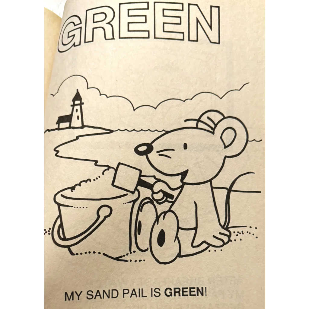 Cartoon mouse by a sand pail on the beach in the Discover America coloring book