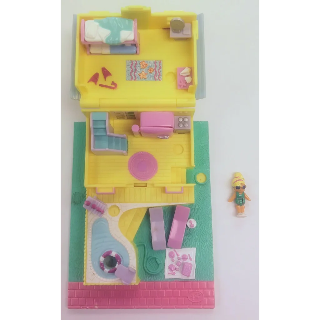 Vintage 1993 Polly Pocket summer beach house playset in yellow and pink with plastic accessories