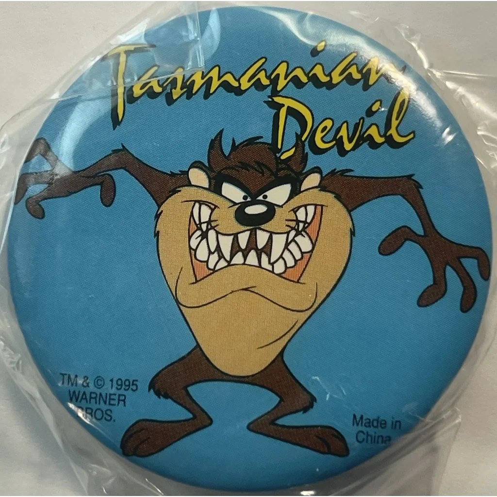 Cartoon Tasmanian Devil on a blue background for this Rare 1995 Looney Tunes pin