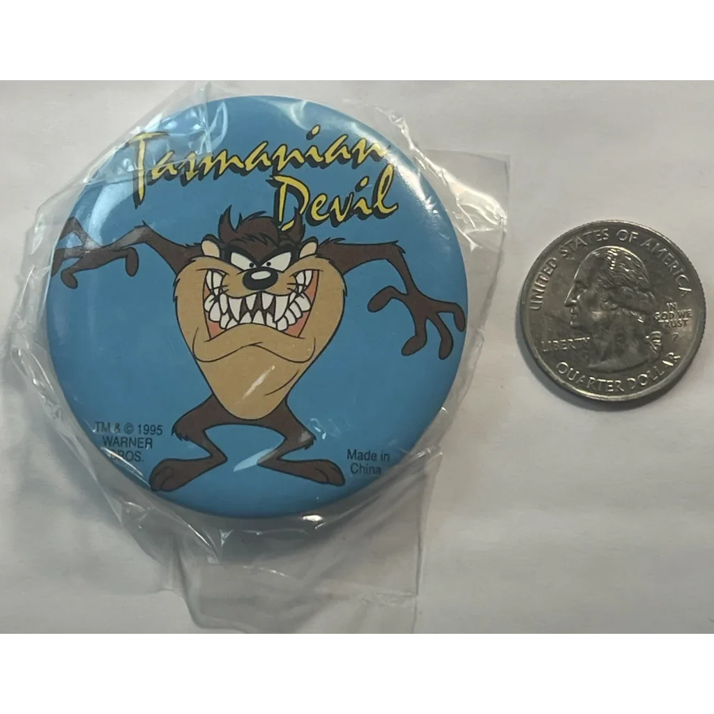 Circular Looney Tunes pin featuring Tasmanian Devil on a blue background