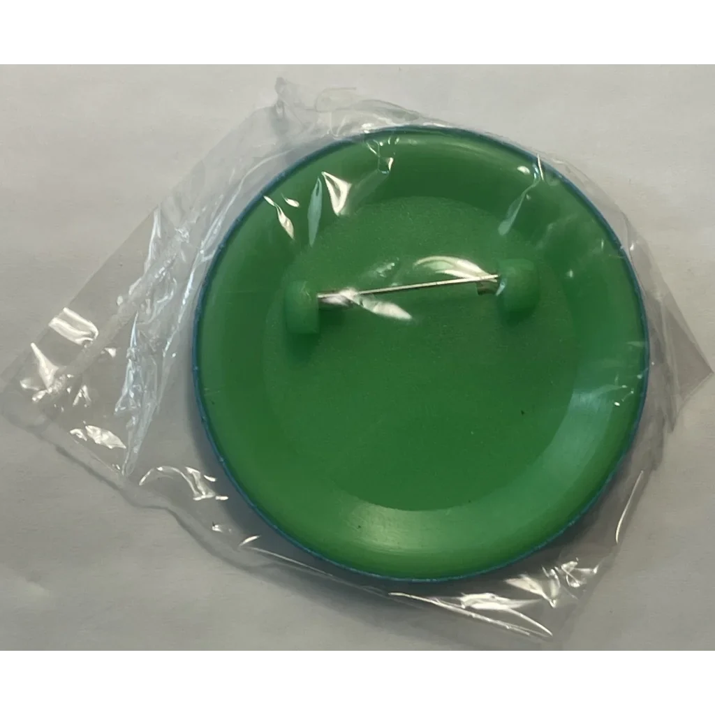 Green plastic lid in clear packaging for Rare 1995 Looney Tunes pin collector’s item