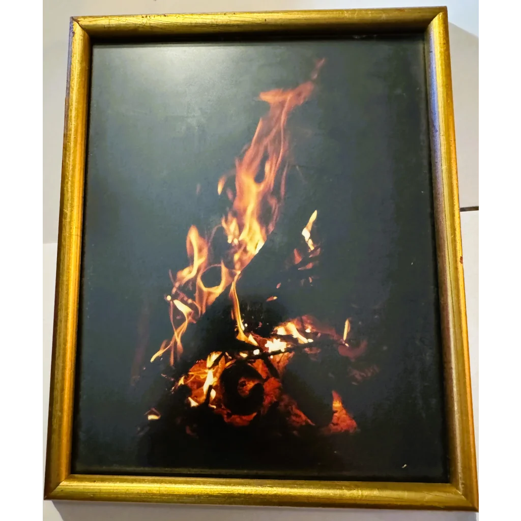 Gold-framed fire artwork from American Hoechst contest entry via 50mm lens