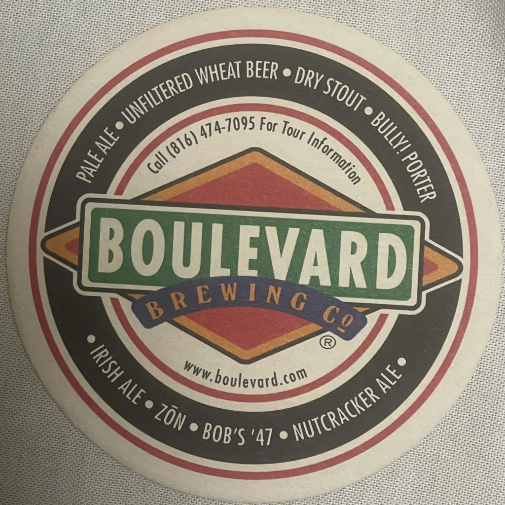 Circular vintage Boulevard Brewing beer coaster showcasing their logo and beer varieties