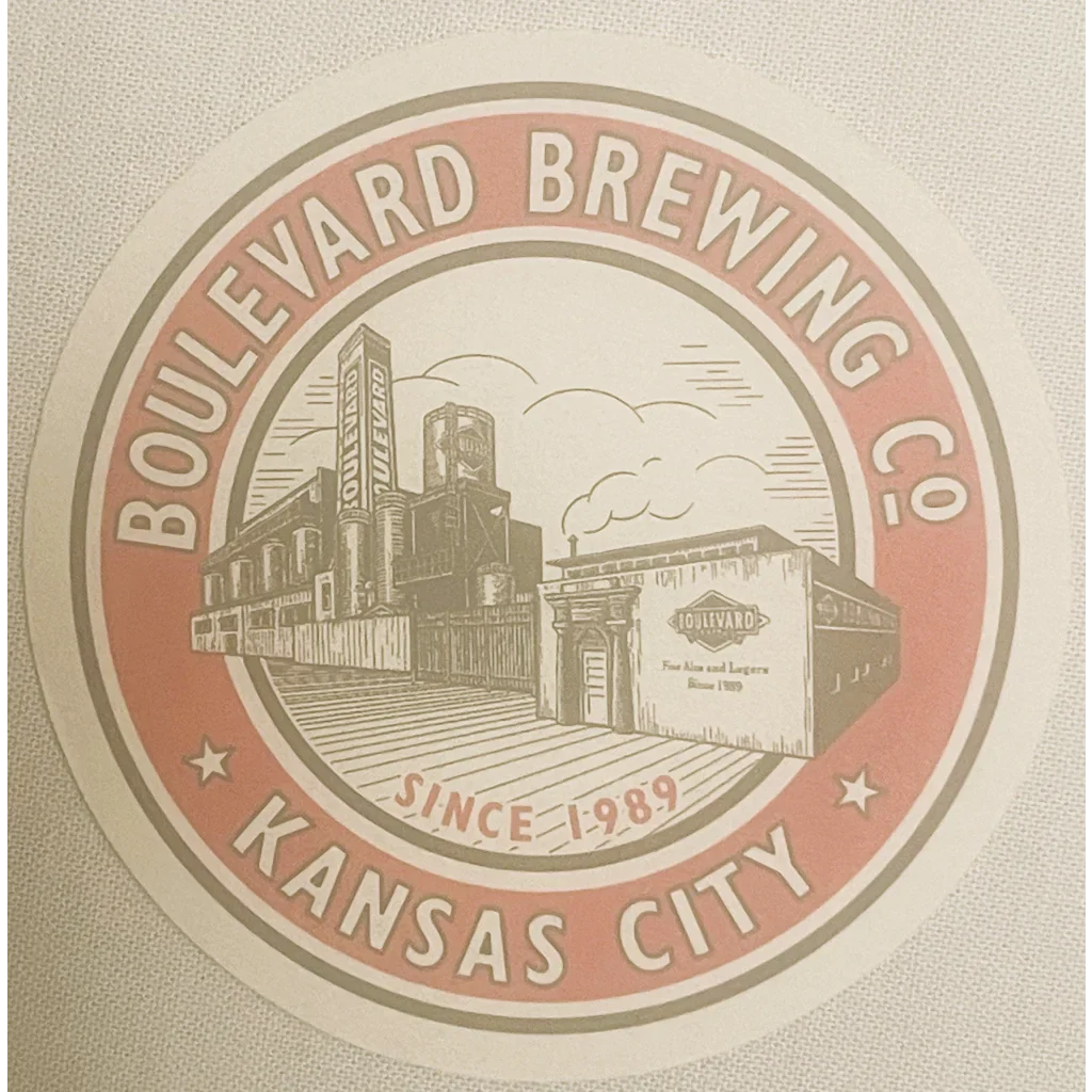 Circular logo of Boulevard Brewing Co. on a vintage beer coaster with an industrial vibe