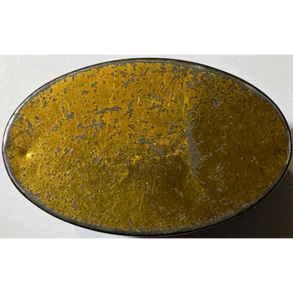 Gold textured belt buckle with black edges, silver accents for personal items