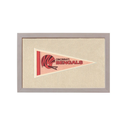 Vintage Cincinnati Bengals pennant with red black helmet on pink background
