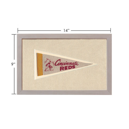 Vintage Cincinnati Reds pennant with beige background and baseball player illustration
