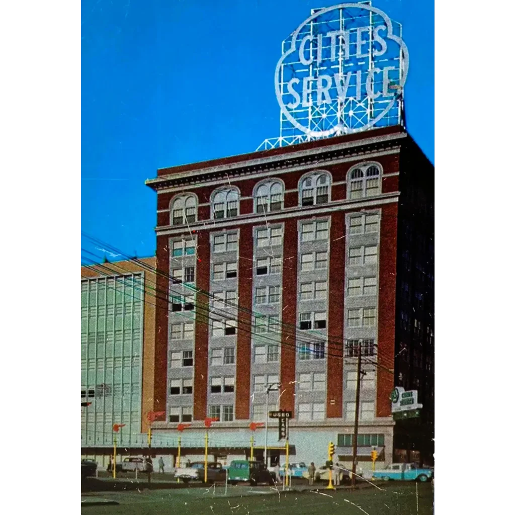 Vintage 1980s cities service company stock certificate featuring red brick building with circular neon cities service sign