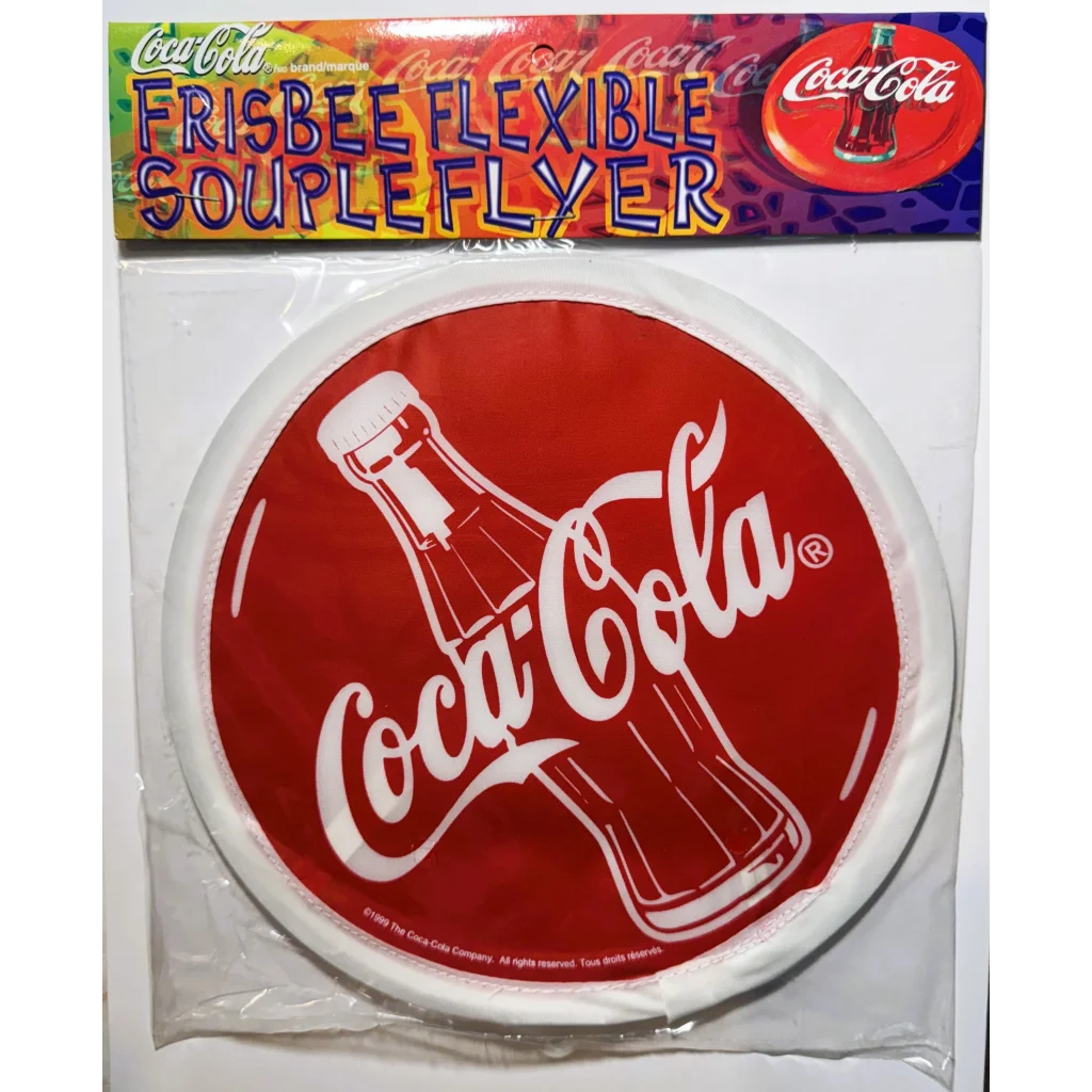 Coca-Cola branded flexible cloth frisbee as NOS soda memorabilia collectible from 1999