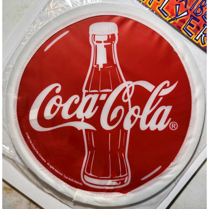 Vintage Coca-Cola Flexible Cloth Frisbee showing NOS soda memorabilia collectible