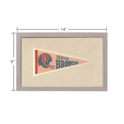 Vintage Denver Broncos pennant framed on pinkish-beige background