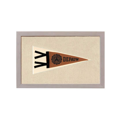Vintage DePauw University pennant in beige frame on off-white background